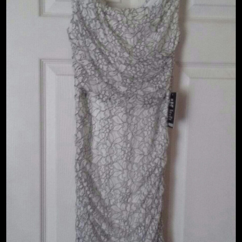 Beautiful dress. Express brand. Comes to the knee